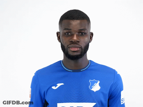 A Man Wearing A Blue Shirt With Tsg 1899 Written On It GIF