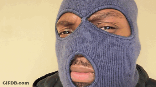 A Man Wearing A Blue Ski Mask With A Hole In The Middle Of His Face GIF