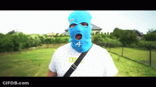 A Man Wearing A Blue Ski Mask With The Number Four On It GIF