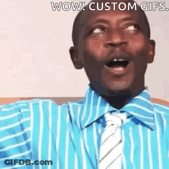 A Man Wearing A Blue Striped Shirt And Tie Is Making A Surprised Face . GIF