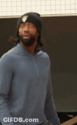 A Man Wearing A Blue Sweater And A Black Beanie GIF