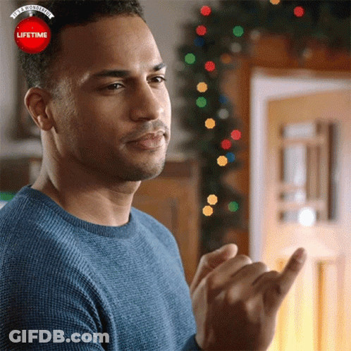 A Man Wearing A Blue Sweater Is Clapping His Hands In Front Of A Lifetime Logo GIF