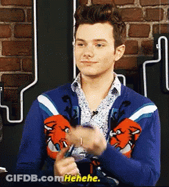 A Man Wearing A Blue Sweater Is Laughing And Says ' Ahehe ' GIF