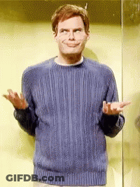 A Man Wearing A Blue Sweater Is Making A Funny Face GIF