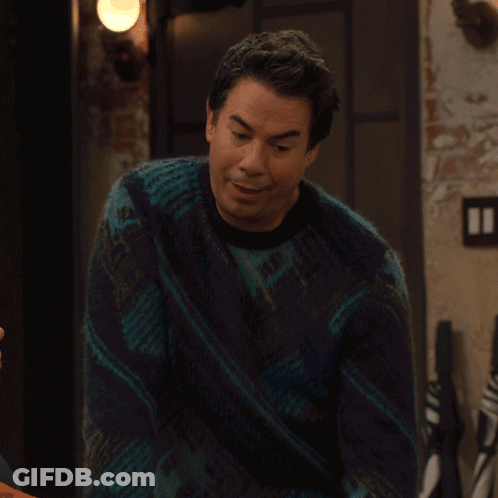 A Man Wearing A Blue Sweater Says I Love It GIF