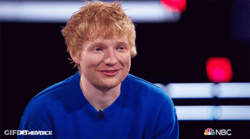 A Man Wearing A Blue Sweater With The Word Nbc On It GIF