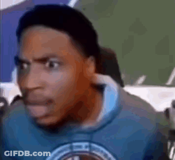A Man Wearing A Blue Sweatshirt Is Making A Funny Face . GIF