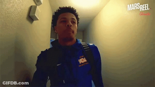 A Man Wearing A Blue Sweatshirt That Says Ncaa Basketball GIF