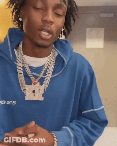 A Man Wearing A Blue Sweatshirt With The Word Issues On The Front GIF
