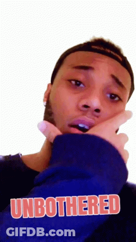 A Man Wearing A Blue Sweatshirt With The Word Unbothered On It GIF