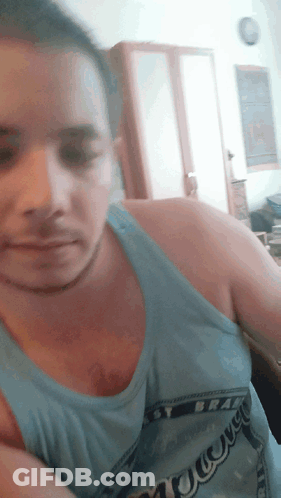 A Man Wearing A Blue Tank Top That Says ' Narrow ' On It GIF