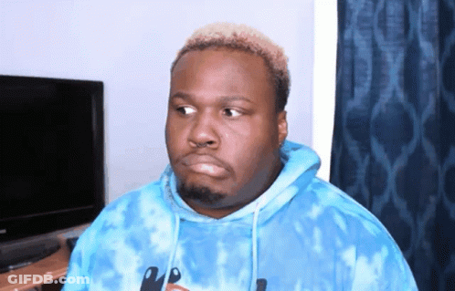 A Man Wearing A Blue Tie Dye Hoodie With A Knife On The Front GIF