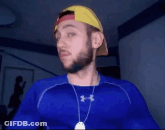 A Man Wearing A Blue Under Armour Shirt And A Hat GIF