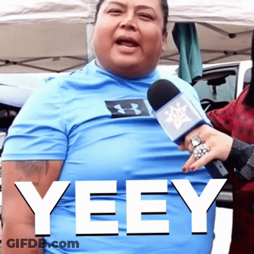 A Man Wearing A Blue Under Armour Shirt Is Being Interviewed By A Woman GIF