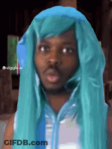 A Man Wearing A Blue Wig And A White Shirt Has The Hashtag Viggles Ai On The Bottom GIF