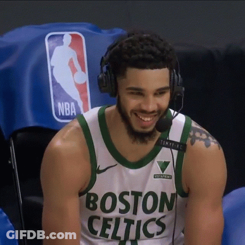 A Man Wearing A Boston Celtics Jersey Is Smiling GIF