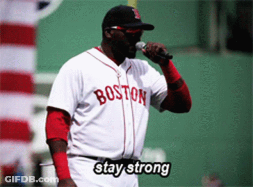 A Man Wearing A Boston Jersey Holds A Microphone GIF