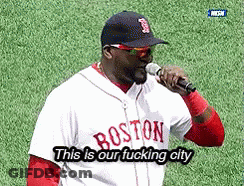 A Man Wearing A Boston Jersey Is Holding A Microphone GIF