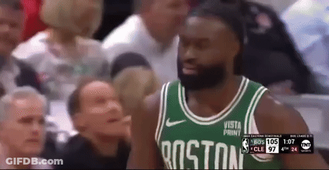 A Man Wearing A Boston Jersey Stands In Front Of A Crowd During A Basketball Game GIF