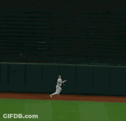 A Man Wearing A Boston Jersey Stands On The Field GIF