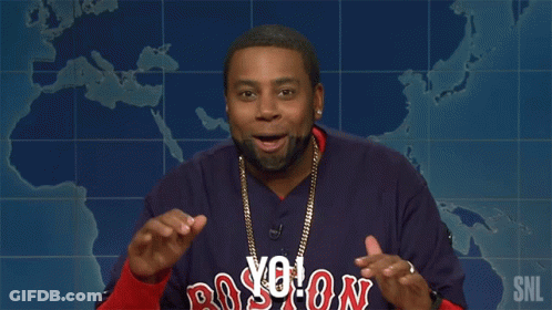 A Man Wearing A Boston Red Sox Jersey Is Giving A Speech GIF