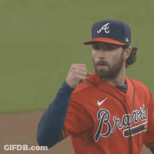 A Man Wearing A Braves Jersey And A Hat GIF
