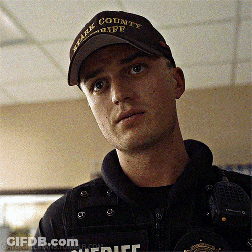 A Man Wearing A Brown Hat That Says Spark County Sheriff GIF