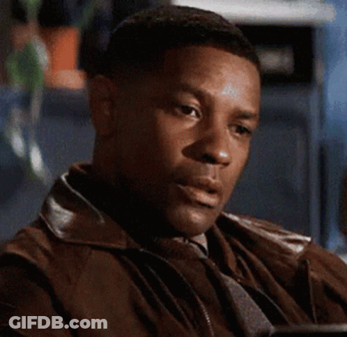 A Man Wearing A Brown Leather Jacket Is Sitting At A Table GIF