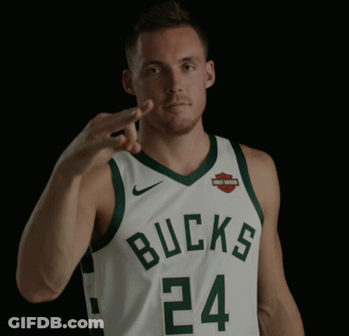A Man Wearing A Bucks Jersey Is Giving A Middle Finger GIF