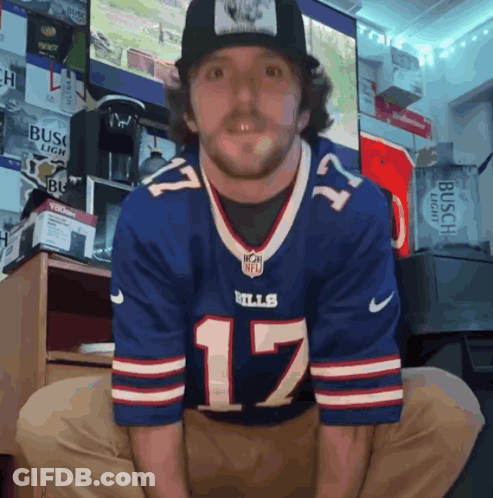 A Man Wearing A Buffalo Bills Jersey And A Hat GIF