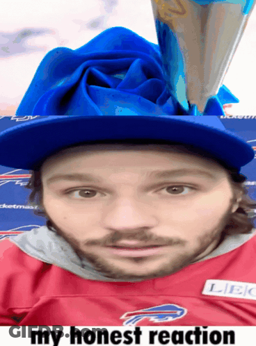 A Man Wearing A Buffalo Bills Jersey Has A Blue Rose On His Head GIF