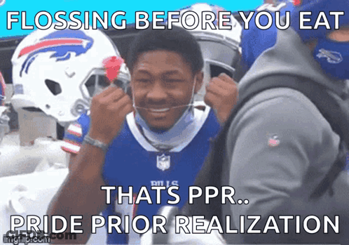 A Man Wearing A Buffalo Bills Jersey Is Flossing His Teeth GIF