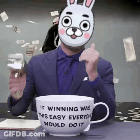 A Man Wearing A Bunny Mask Is Sitting In Front Of A Cup That Says If Winning Was This Easy Everyone Would Do It GIF