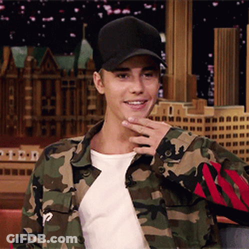 A Man Wearing A Camo Jacket And A Black Hat GIF