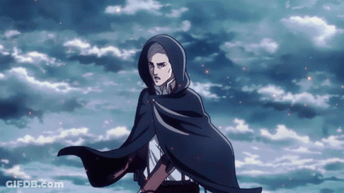 A Man Wearing A Cape With A Hood Is Standing In Front Of A Cloudy Sky GIF