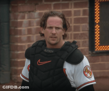 A Man Wearing A Catcher 'S Chest Protector With The Word Rutsch On It GIF