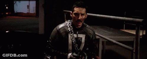 A Man Wearing A Chain Around His Neck Has The Number 7 On His Chest GIF