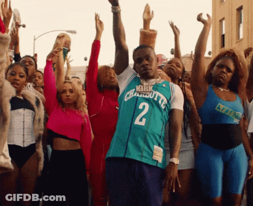 A Man Wearing A Charlotte Jersey Number 2 Stands In Front Of A Crowd Of People GIF