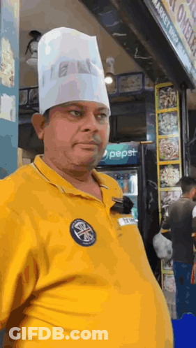 Man In Chef's Hat In Front Of Pepsi Refrigerator GIF
