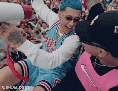 A Man Wearing A Chicago Bulls Jersey Is Being Lifted By A Man Wearing A Pink Nike Vest GIF