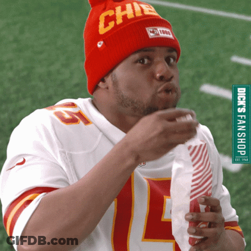 A Man Wearing A Chiefs Jersey And A Red Hat GIF