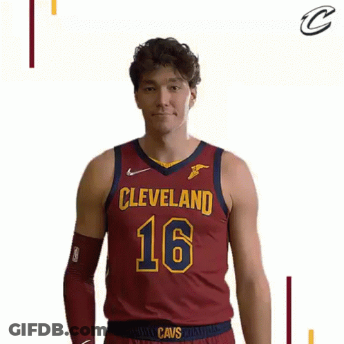 A Man Wearing A Cleveland Cavs Jersey Is Making A Funny Face . GIF