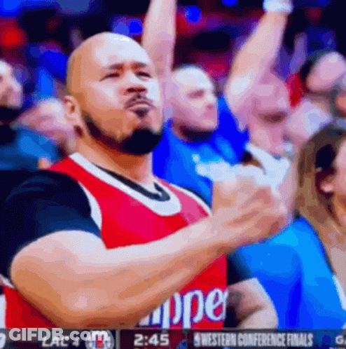 A Man Wearing A Clippers Jersey Is Giving A Thumbs Up GIF