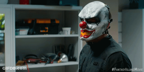 A Man Wearing A Clown Mask Has The Hashtag Fantasyislandmovie On The Bottom GIF