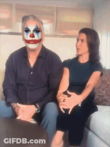 Man In Clown Mask Sitting Next To Woman GIF