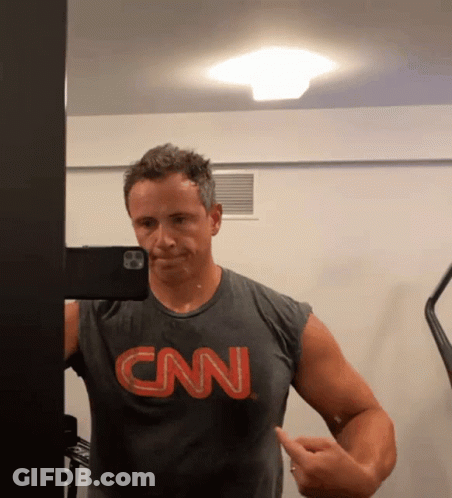 A Man Wearing A Cnn Shirt Takes A Selfie GIF
