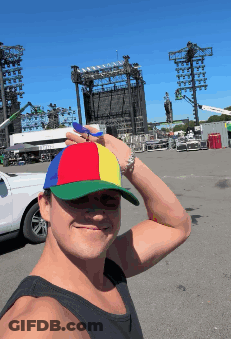 A Man Wearing A Colorful Hat Takes A Selfie GIF