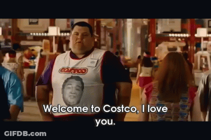 A Man Wearing A Costco Apron Says Welcome To Costco GIF