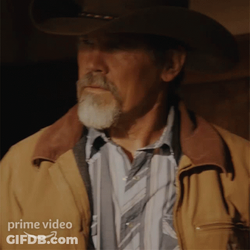 A Man Wearing A Cowboy Hat And A Brown Jacket Has A Prime Video Logo On The Bottom Right GIF