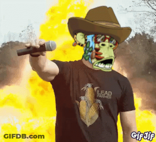 A Man Wearing A Cowboy Hat And A Lead Farmer Shirt GIF